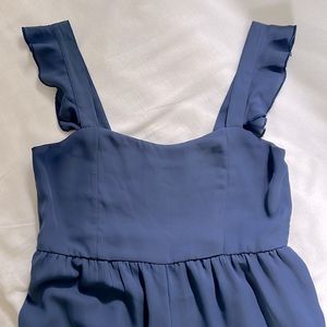 Adorable midi length blue jumpsuit.  Lined to just under knee.  Light weight
